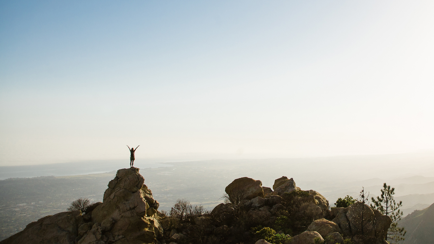 woman on a boulder in nature